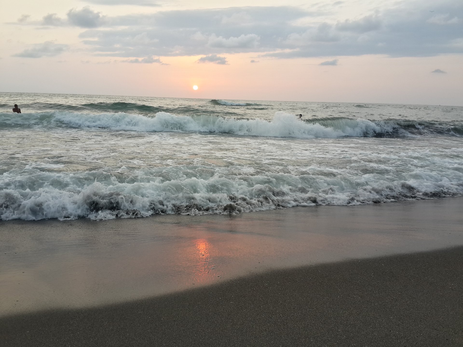 Black magnetic sand in Ureki at sunset